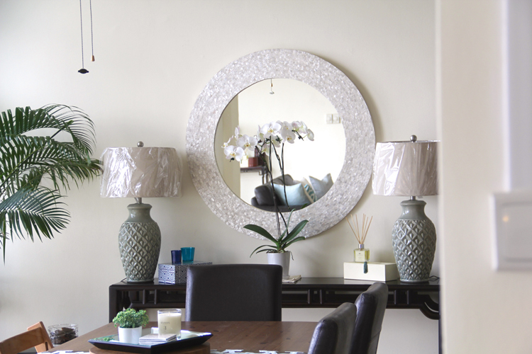 Round white capiz shell mirror, $700