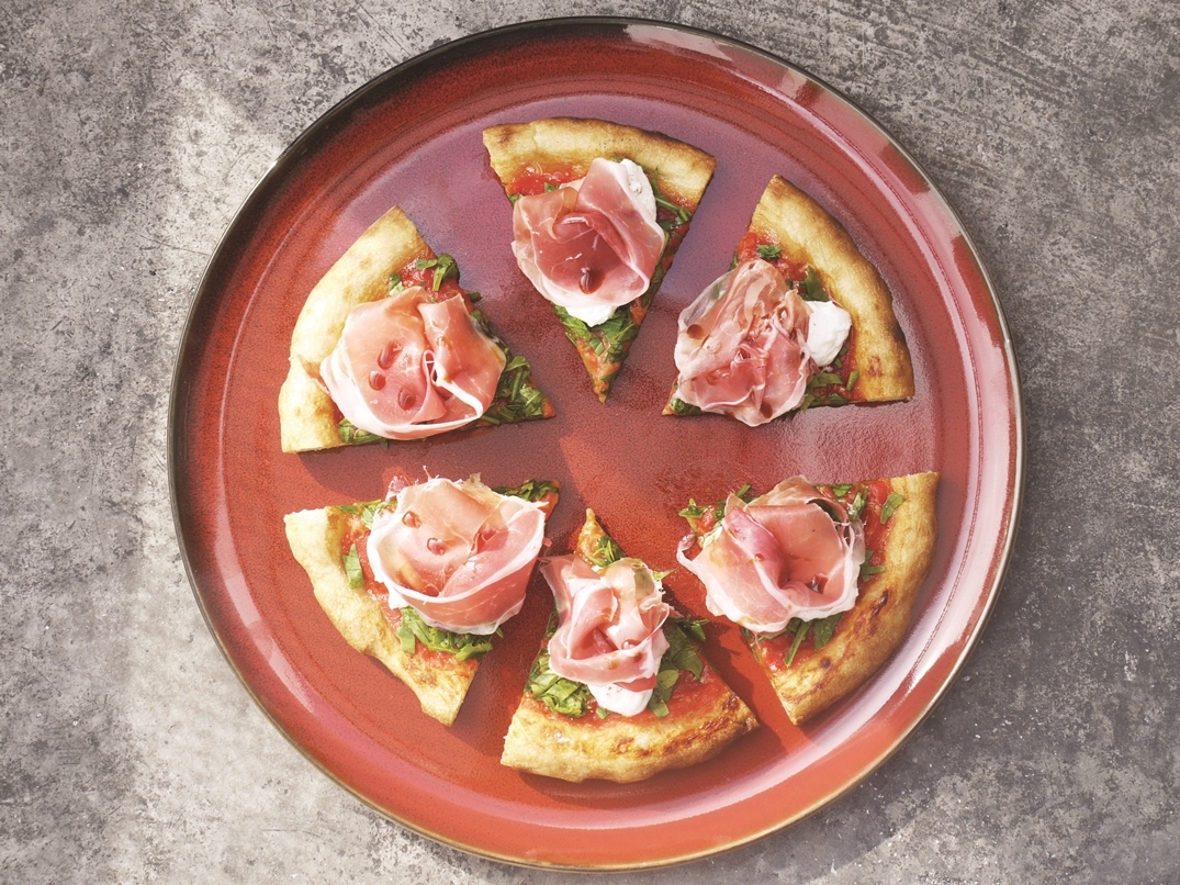 Stracciatella, prosciutto, rocket and fig vincotto pizza