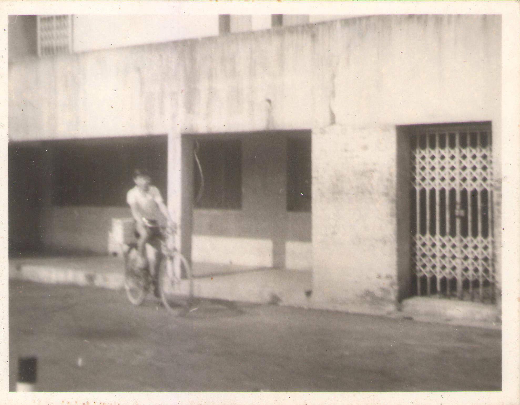 Then: Outside the air raid shelter at Guan Chuan Street